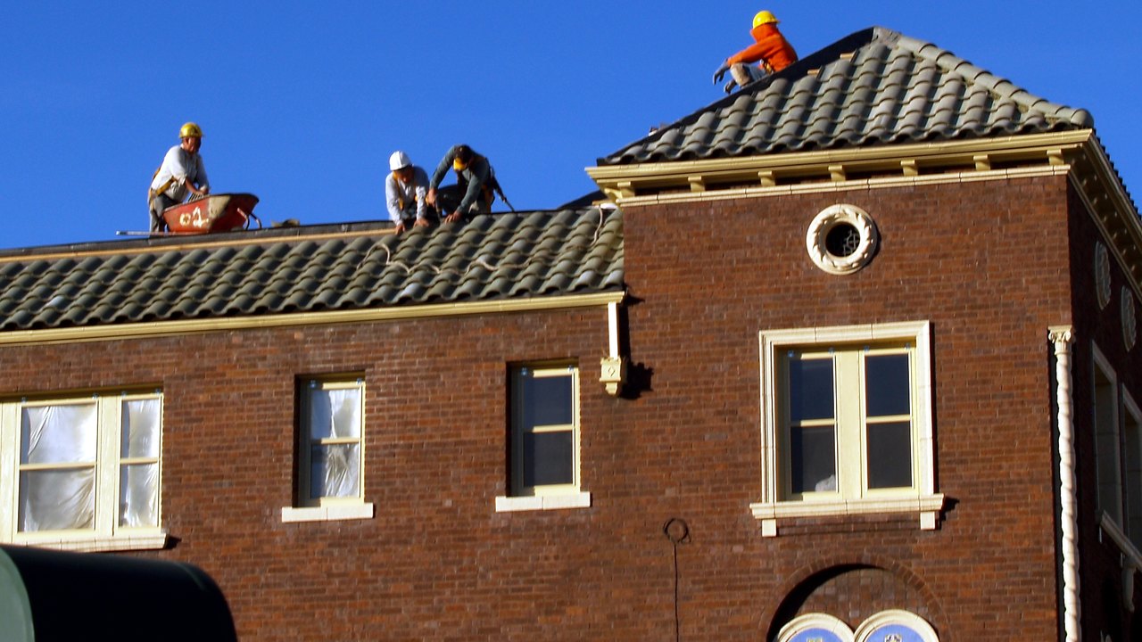 Roof Replacement in Kyle, TX - Professional roofers installing a new roof